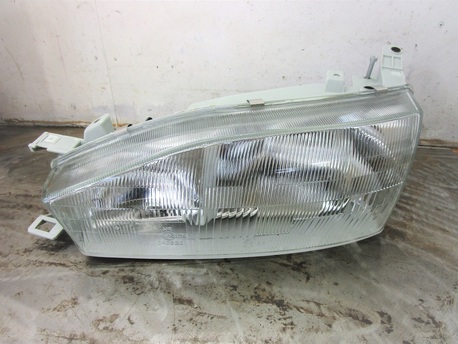 TOYOTA CAMRY ´92-96 - E-LYHTY H4/H1 VASEN ( MAN.SÄÄTÖ )