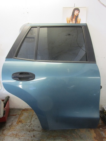 takaovi oikea - Hyundai Santa Fe  ´03